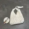 Bolsa tejida nueva versión coreana 2026, bolsa de hilo floral artística, bolso de hombro, bolso de playa calado para vacaciones en la costa