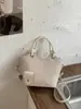 Bolso de cubo tejido a la moda y moderno, bolso cruzado de nicho único y elegante, bolso tote casual chic estilo coreano para el día a día