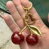 El Llavero Colgante de Cereza con Gradiente Morado Creativo Más Vendido de Amazon para Ventas Transfronterizas