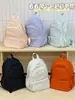 Mochila Escolar Menina 2026 Novo Estilo Mochila de Viagem Bolsa de Nylon Feminina Versátil Casual Mochila de Grande Capacidade Bolsa de Ombro