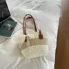 Nova bolsa balde de moda color-block transfronteiriça para o dia a dia, bolsa de palha listrada para praia, bolsa de ombro casual para viagem e bolsa tote