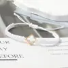 Pulsera tejida de nudo plano de trébol de cuatro hojas de venta caliente transfronteriza para parejas y estudiantes, tendencia europea y americana inspirada en la dopamina, joyería al por mayor de fabricante
