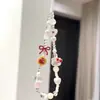 Cadena Minimalista para Teléfono con Perlas y Lazo, Correa de Muñeca, Cadena de Mano, Portacámaras y Llavero para Mujer