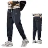 Pantalones de pana transfronterizos para hombre, otoño e invierno, marca de moda bordada, pierna holgada, pantalones deportivos para hombre, pantalones casuales gruesos con forro polar