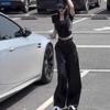 Conjunto de dos piezas moderno para 2025, de corte corto y ajustado, con cuello redondo y manga corta, nuevo de verano en negro, con pantalones casuales de pierna ancha y talle alto