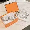 Taza de Café y Platillo de Hueso de Porcelana Gris Estándar Europeo con Juego de Cuchara Regalo de Boda Exquisito de Gama Alta Caja de Regalo para Taza