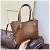 Bolso Pequeño Transfronterizo para Mujer 2026 Nuevo Diseño Retro de Nicho Bolso de Mano Tipo Cubo Bolso de Hombro Cruzado Tejido a la Moda