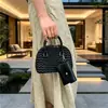 Bolso de Mano con Forma de Concha Retro Simple Elegante para Madre e Hijo Bolso Cruzado de Hombro Único Nuevo Primavera 2026 Bolso Casual de Moda para Mujer