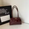 Bolso de hombro para mujer 2026 gran capacidad moderno coreano modelo nuevo de invierno con acabado brillante y diseño simple