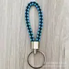 Llavero de cuerda de cuero trenzado simple creativo colgante de muñeca linda accesorios de llave para parejas tendencia regalos pequeños venta al por mayor