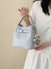 Nova bolsa de mão 2026 para mulheres, bolsa de ombro e transversal super popular e versátil para o mercado internacional, bolsa tipo balde de alta qualidade para o público de nicho para o dia a dia