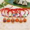 Bolsitas tejidas hechas a mano más vendidas para niños y adultos, Pulseras de Zongzi de Tigre con Cascabeles, Pulseras de Hilo Colorido para el Festival del Bote del Dragón 2026