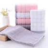 Toalla de lavado facial al por mayor para el hogar de algodón unisex toalla facial de algodón absorbente de pelusa toalla de baño empaque independiente