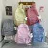 Mochila estilo japonês ins, xadrez fresco, cor de doce, para meninas, adequada para alunos do ensino fundamental II e médio, casual e versátil, bolsa de ombro dupla de grande capacidade