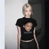 Camiseta Negra de Manga Corta con Hombro Normal para Mujer, Estilo Americano con Estampado de Chica Picante, Nueva Moda Retro Ajustada de Verano 2026