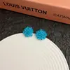 Pendientes de flor tejida azul Klein explosión de verano diseño fresco dulce personalidad exquisita joyería para orejas de moda