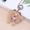 Boneca de Pelúcia Estatueta de Estudante Pingente de Sino Capivara Lendo Bolsa com Pom-Pom Decoração Chaveiro Fofo