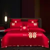 Juego de ropa de cama de lujo estilo chino, hecho de algodón 100% de fibra larga, un juego de cuatro piezas que incluye una sábana y una funda de edredón de algodón puro rojo, perfecto para la alcoba de una recién casada.