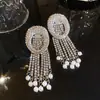 Brincos de borla em formato de flor com zircônia super brilhante, estilo europeu e americano de luxo, brincos de banquete do palácio, brincos de luxo leve de alta qualidade para mulheres