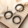 Pulsera de cuentas de cristal de ágata negra estilo ins europeo y americano, pulsera tejida a mano con piedra de ojo de tigre, joyería de mano todo en uno para mujer, venta al por mayor