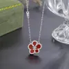 Collar de flor de dinero de la suerte de plata pura 999 para mujer, colgante de flor de ágata roja y diamante versátil de nicho, cadena para clavícula nueva 2026