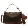 Bolso tipo almohada de gamuza de alta gama ultra moderno estilo coreano para mujer, nuevo de moda 2026, versátil, de gran capacidad, para hombro y cruzado