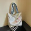 Bolso de mujer suave y liso de alta calidad, nuevo modelo 2026, bolso tote de gran capacidad para el trabajo diario, bolso de hombro versátil para comercio exterior