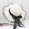 Nuevo Sombrero de Paja para Mujer Verano Viaje Sombrilla Sombrero Playa Mar Protector Solar Sombrero Estilo Coreano Ala Ancha Moño Anti-UV