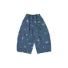 Ropa Infantil Nuomi Wanzi 2026 Otoño Dibujos Animados Estampado Completo Jeans Infantiles Pantalones Anchos Sueltos para Niñas Pantalones Curvos
