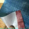 Venta al por mayor del fabricante Tela tejida de PE impermeable de doble cara Tela a rayas de color plástico Tricolor Material para bolso de mano Bolso tipo piel de serpiente Imagen fina
