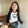 Camiseta infantil de manga longa com mangas raglan, nova coleção primavera e outono, top da moda para o início do outono para crianças, peça externa de algodão puro, camada base