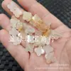 Xinjiang Hotan Seda Dorada Jade Flor Cruzada Jade Cuentas Sueltas Flor de Cuatro Pétalos Pulsera Collar Pendientes Pasador Accesorios Joyería Cuentas