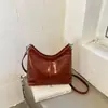 Nueva colección otoño/invierno 2026: Bolso de mano coreano simple, retro, moderno y versátil con un toque de alta gama, diseñado para mujeres, y se puede llevar como bandolera o bolso de hombro