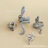 Conjunto de 4 anillos exagerados retro con diseño de serpiente para hombre, estilo punk, estilo retro, con forma de serpiente, de comercio exterior europeo y americano