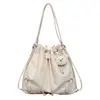 Bolsa Nueva de Gran Capacidad, Mochila Sencilla, Bolso Cubo Casual, Bolso de Hombro Único con Cordón para Commuter de Mujer, Estilo Coreano 2026