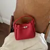 Bolso Tote Pequeño Súper Caliente para Mujer 2026 Nuevo Verano Popular de Gama Alta para Viajes Diarios Hombro Único Cruzado Bolso Cubo
