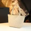 Bolso de Mano Genuino Estilo Resort 2026 Nuevo Casual Versátil Pequeño Bolso Tejido de Hombro Bolso Cruzado Simple para Mujer