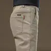 Calça de trabalho transfronteiriça masculina slim fit versátil calça masculina outono e inverno nova reta solta masculina casual wear resistente ao desgaste calça comprida