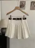 Falda plisada de cintura alta estilo preppy Omalai 2026 Primavera y Verano Falda corta con cinturón para mujeres petite 6959