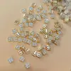 Nuevo arte de uñas transfronterizo color circón trébol de cuatro hojas joyería de circón de lujo japonesa flor accesorios para uñas diamante al por mayor