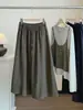 Falda versátil de color liso simple de moda estilo coreano para mujer, nueva falda de paraguas acampanada línea A de cintura alta adelgazante con cordón