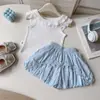Conjunto Feminino Verão Novo 2026 Top Colete de Manga Flare Shorts Floridos Estilo Coreano Elegante Conjunto de Duas Peças para Bebê
