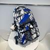 Mochila al por mayor, mochila de moda con grafiti de gran capacidad, mochila para estudiantes de secundaria, mochila de moda para estudiantes.