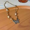 Collar de cuentas de mariposa estilo chino retro de madera y mariposa para mujer, cadena de clavícula de estilo étnico de lujo ligero y de alta gama.