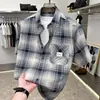 Camisa de cuadros de manga corta para hombre para el verano, nuevo modelo 2026, camisa de manga tres cuartos, chaqueta ligera para adolescentes, cárdigan, disponible para venta al por mayor