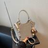 Bolso pequeño casual simple transfronterizo para mujer 2025 Otoño Nueva moda Bolso de mano tipo cubo para viajero Bolso cruzado con textura