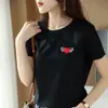 Camiseta de algodón mercerizado de color liso con cuello redondo, alas bordadas, corte slim favorecedor, nueva para primavera y verano, manga corta para mujer, hilo 100% algodón