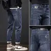 Jeans de Sarja Preta Primavera e Outono Masculino Solto de Perna Reta 2026 Nova Marca Tendência de Outono Slim Fit Elástico Casual Calça Longa