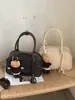 Bolsa de concha para bolos para mujer, estilo retro simple de nicho, bandolera simple, bolsa de axila, bolsa cruzada estilo viaje y desplazamiento