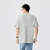 Camiseta casual de alta gama estilo americano con textura a cuadros de manga corta para hombre, nuevo estilo Primavera y Verano 2026, top holgado y cómodo para hombre